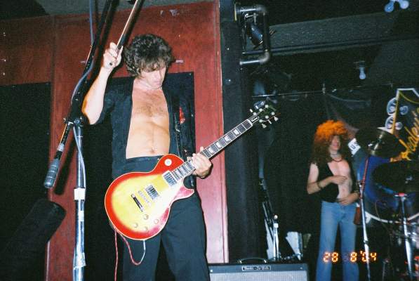 Gary with his guitar and bow.JPG